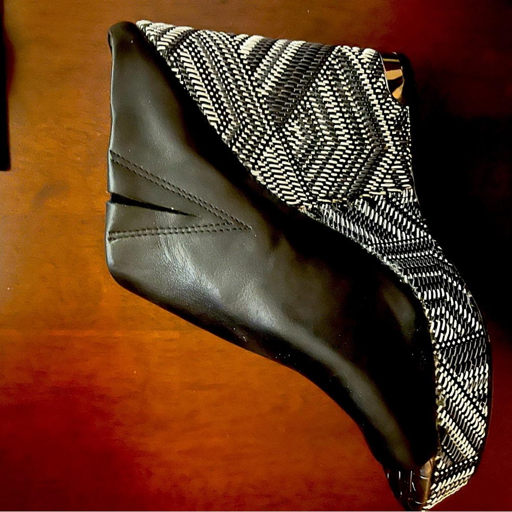 Sam Edelman Black Wedge Heel.  Never worn. Wedge is vibrant with silver metal